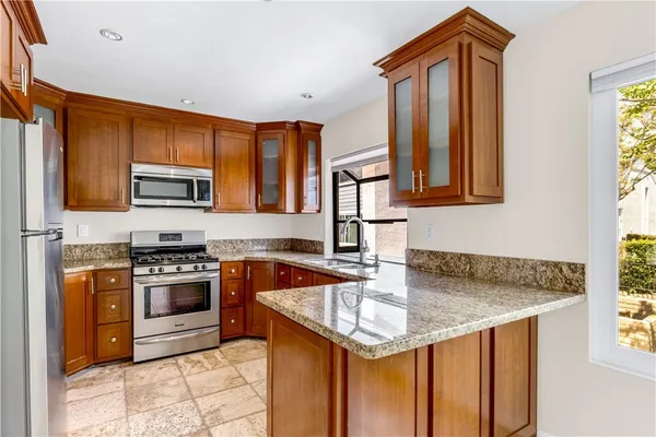 a view of a kitchen with a sink and cabinets