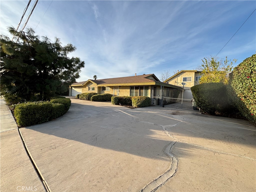 150 West Metz Road Perris, CA 92571 - Photo 1 of 1 a front view of a house with a yard