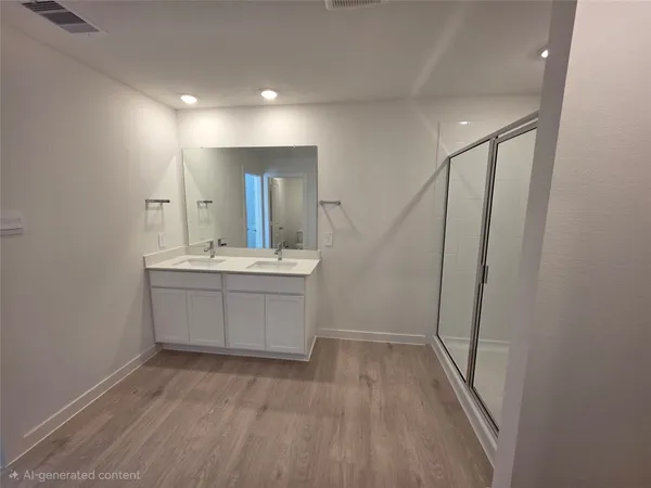 a bathroom with a sink a mirror and a shower