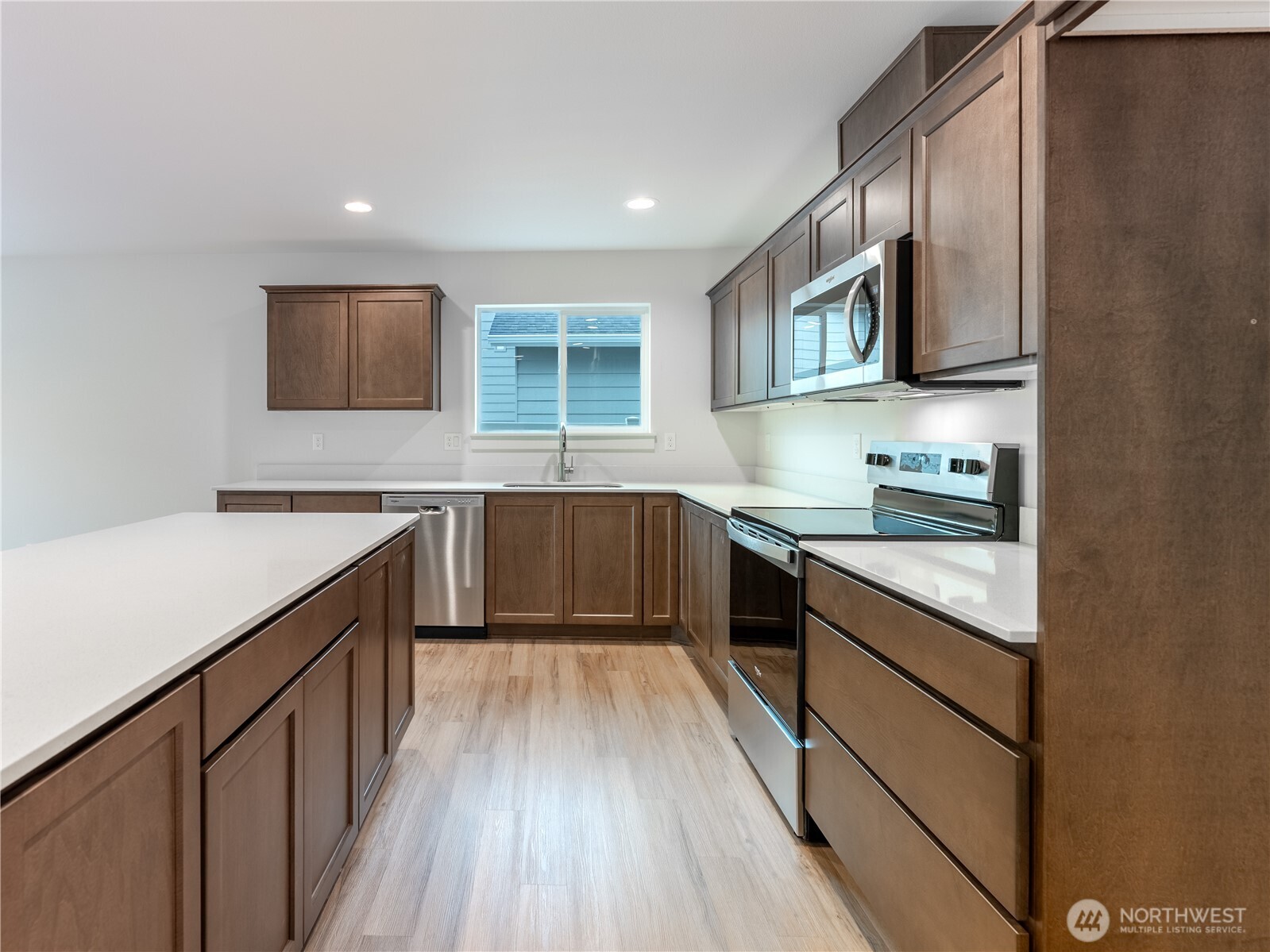 104 Salmon Drive Wenatchee, WA 98801 - Photo 11 of 35 a kitchen with stainless steel appliances granite countertop sink stove top oven and cabinets