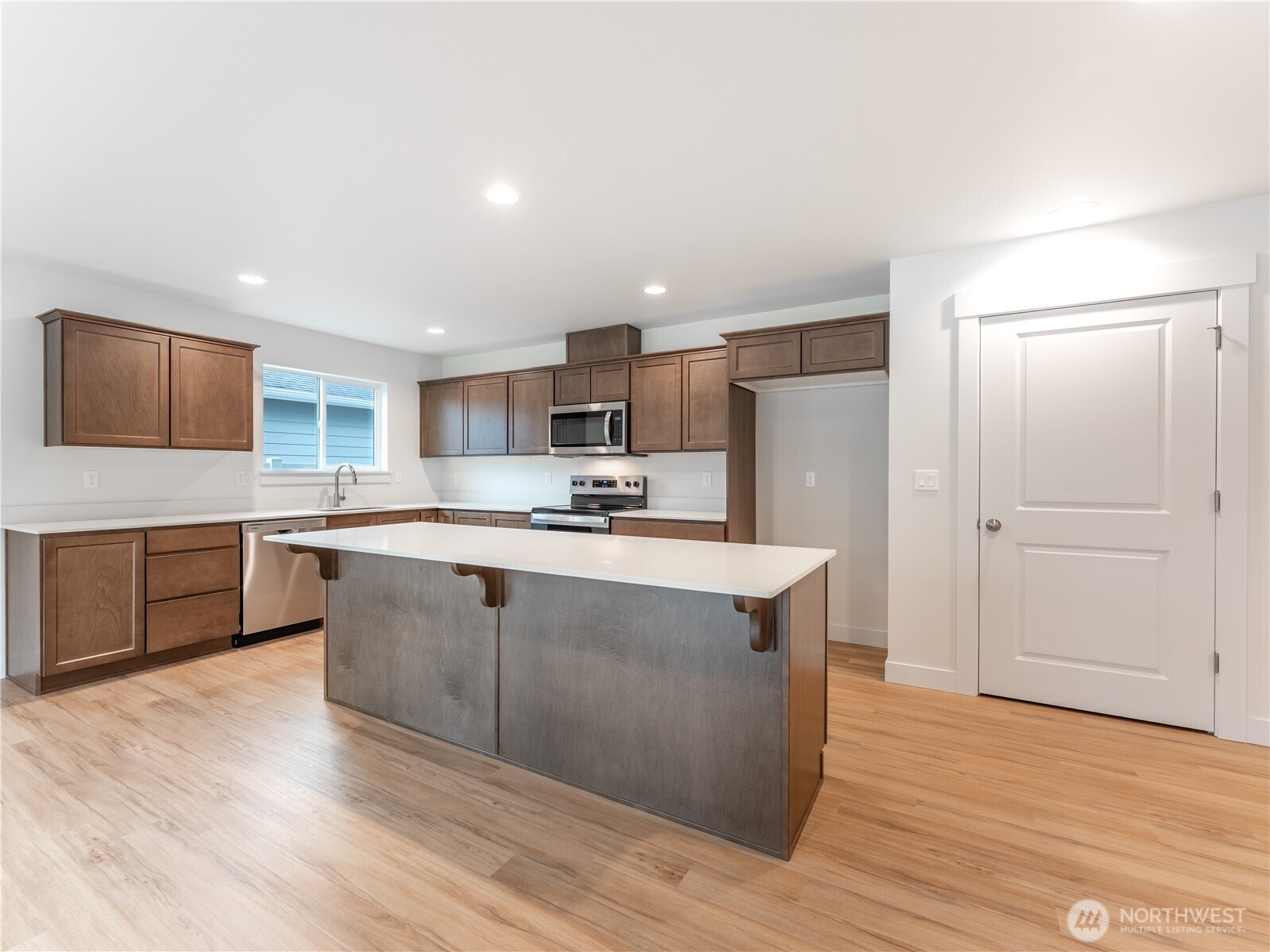 104 Salmon Drive Wenatchee, WA 98801 - Photo 13 of 35 a kitchen with stainless steel appliances granite countertop a stove a sink and a refrigerator