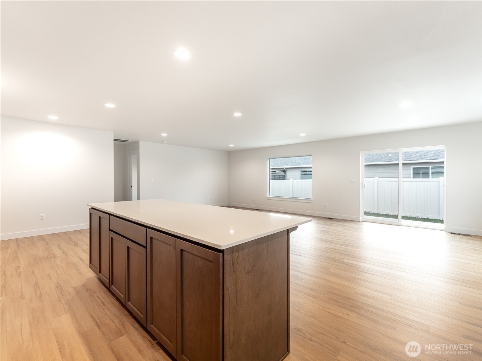 104 Salmon Drive Wenatchee, WA 98801 - Photo 15 of 35 a kitchen with a wooden floor and large window