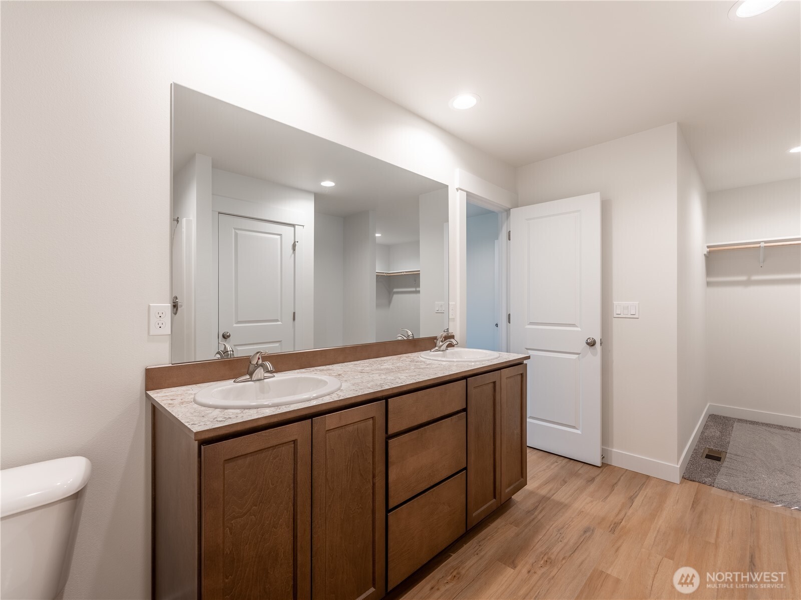 104 Salmon Drive Wenatchee, WA 98801 - Photo 25 of 35 a bathroom with a granite countertop sink a toilet and a mirror