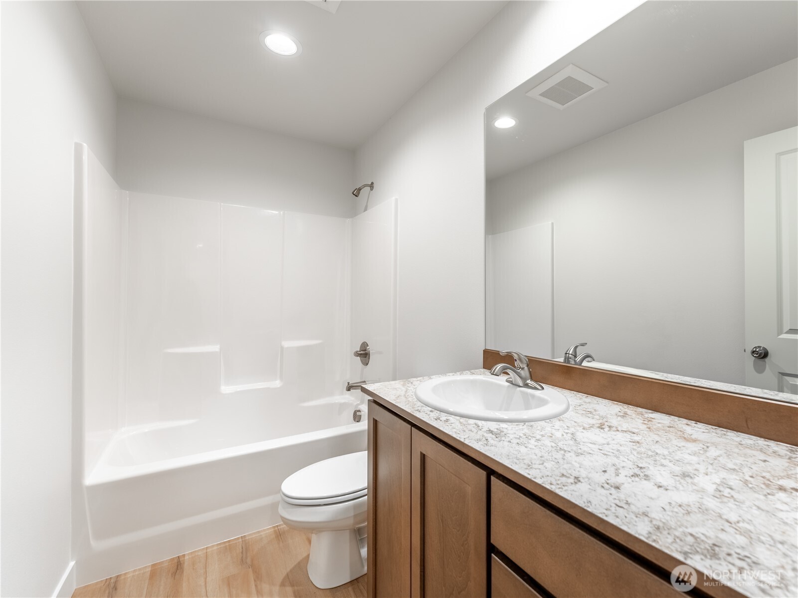 104 Salmon Drive Wenatchee, WA 98801 - Photo 30 of 35 a bathroom with a granite countertop sink a toilet and bathtub