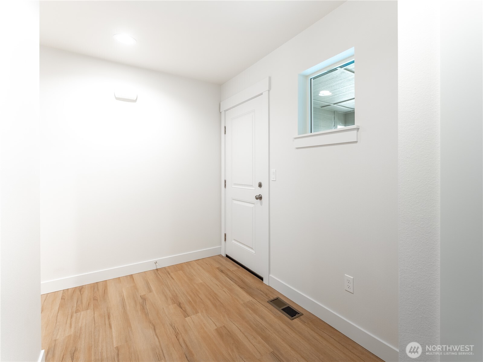 104 Salmon Drive Wenatchee, WA 98801 - Photo 3 of 35 a view of a small space with wooden floor and a window