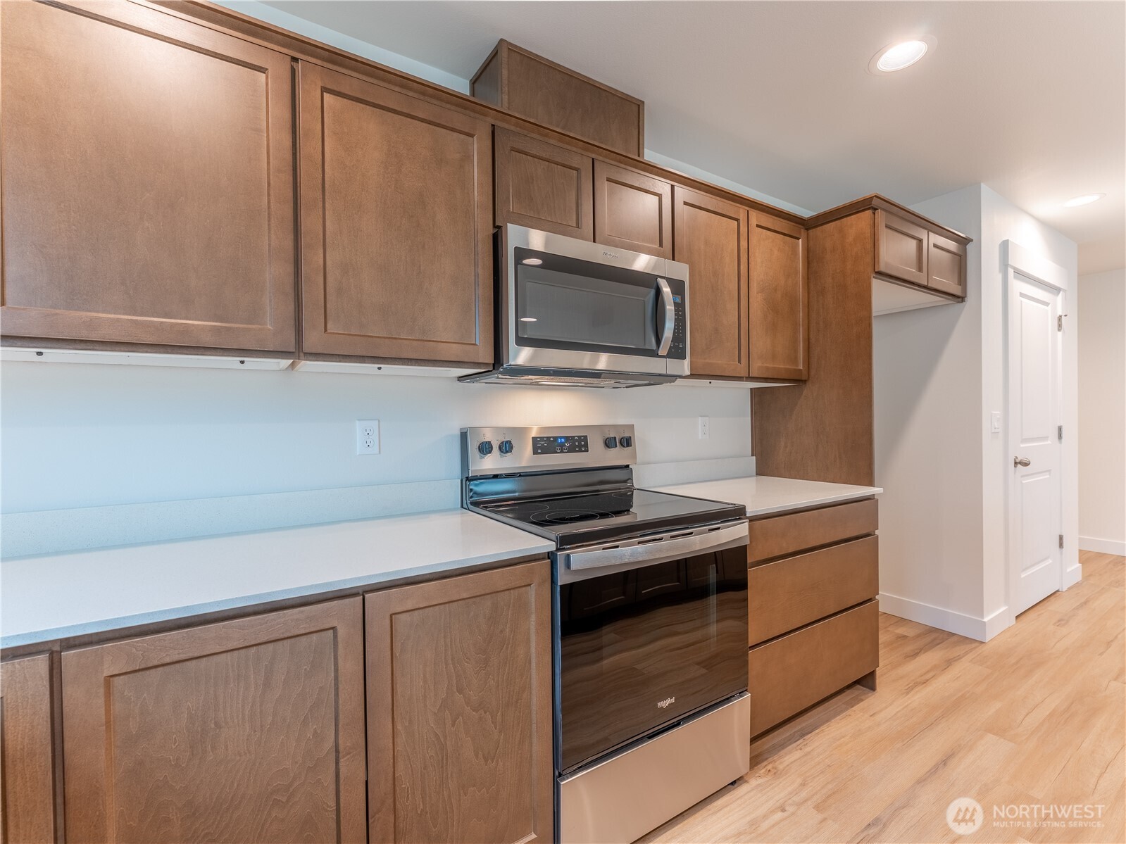 104 Salmon Drive Wenatchee, WA 98801 - Photo 10 of 35 a kitchen with granite countertop wooden cabinets and stainless steel appliances
