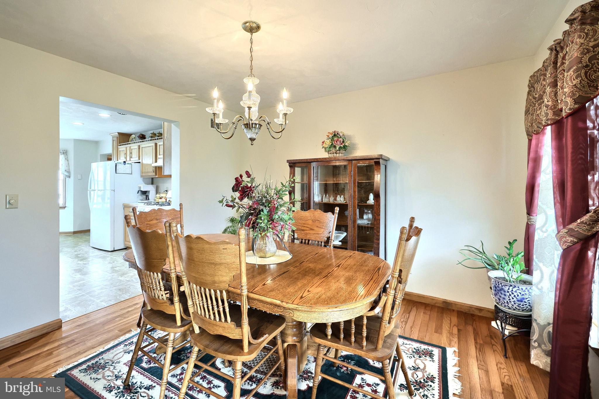 574 Mathias Road Littlestown, PA 17340 - Photo 17 of 65 a view of a dining room with furniture and chandelier