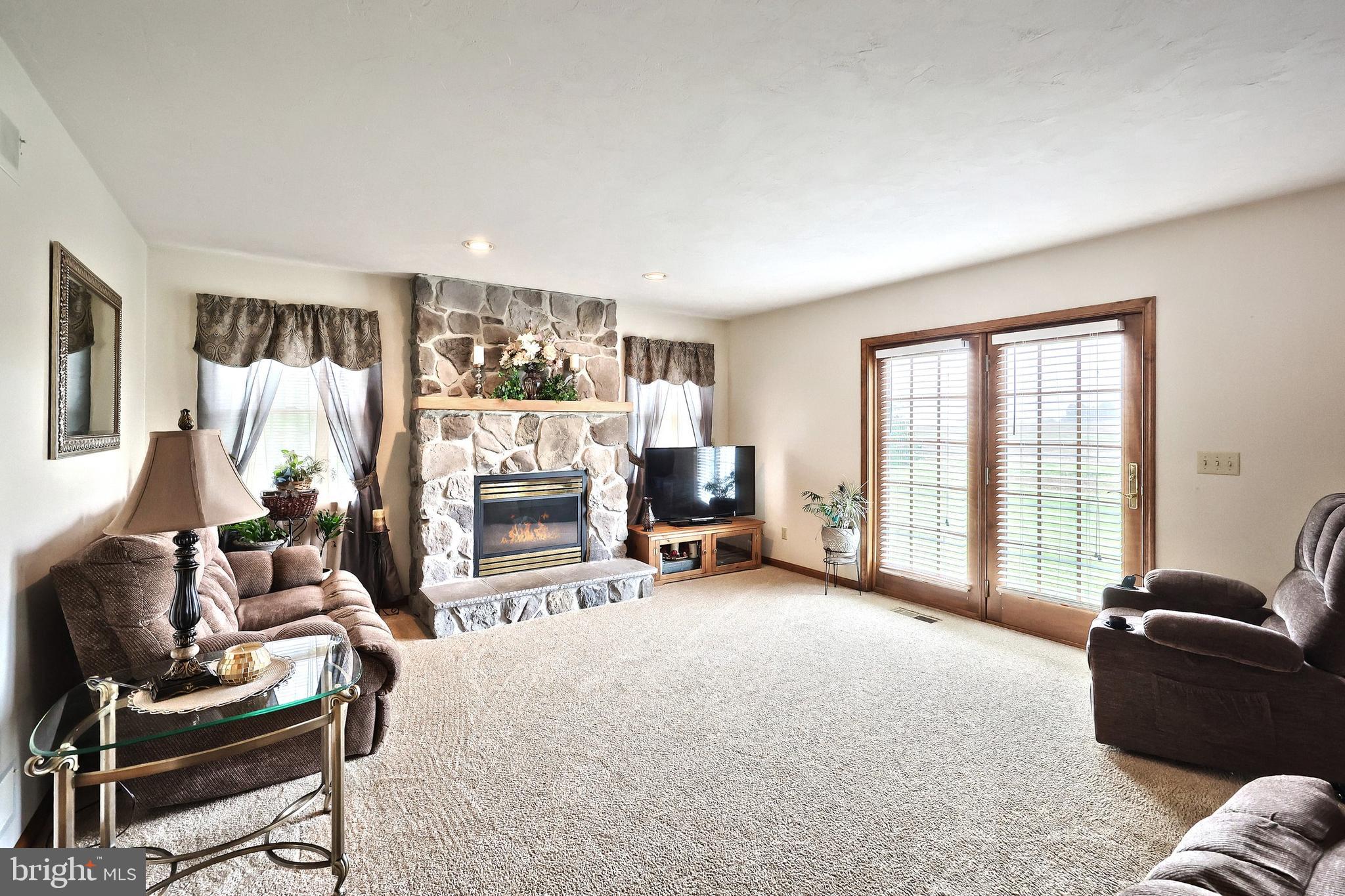 574 Mathias Road Littlestown, PA 17340 - Photo 19 of 65 a living room with furniture and a fireplace