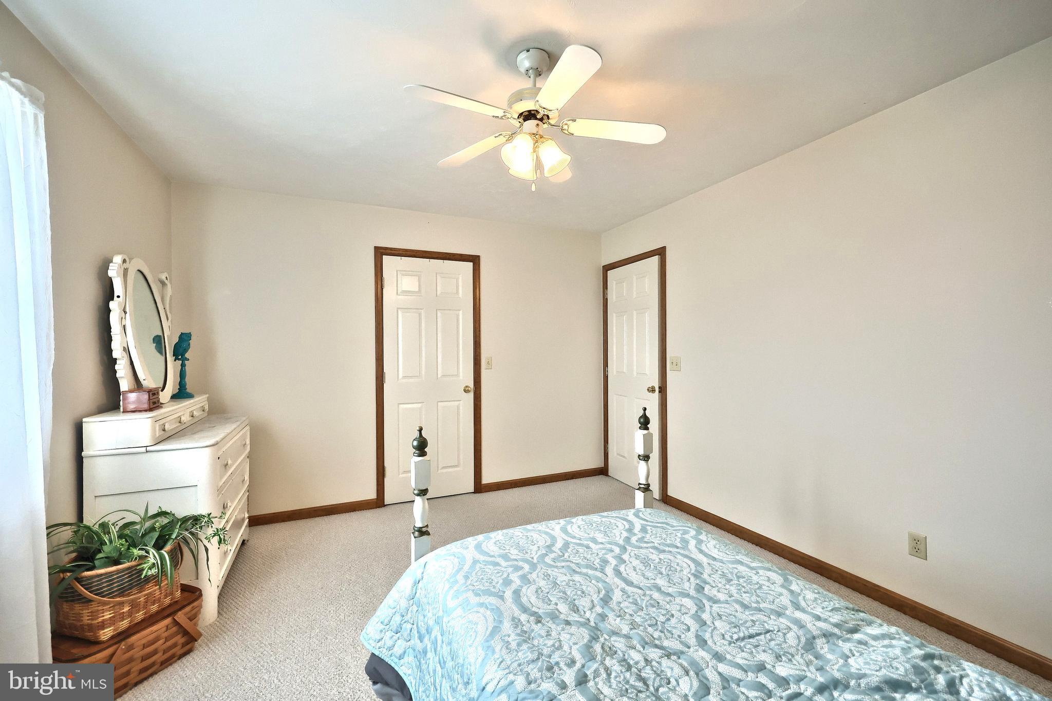 574 Mathias Road Littlestown, PA 17340 - Photo 34 of 65 a bedroom with furniture and a chandelier