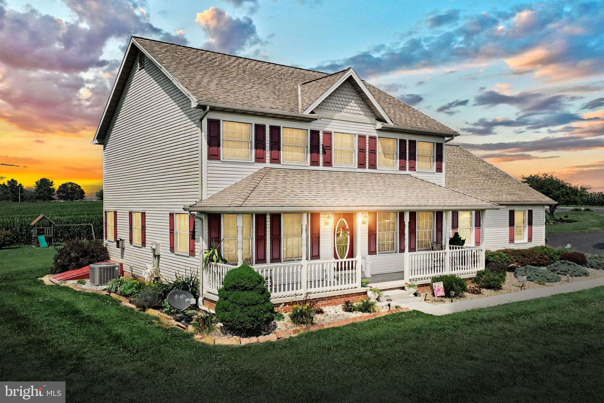 574 Mathias Road Littlestown, PA 17340 - Photo 43 of 65 a front view of a house with a yard and outdoor seating