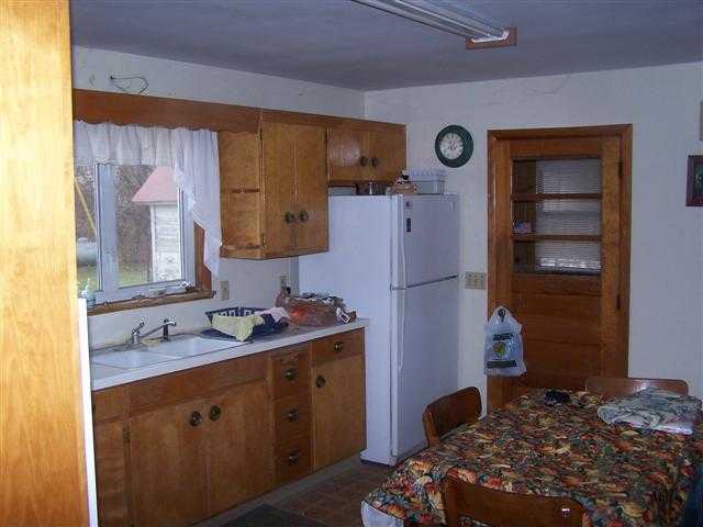 8513 South Massbach Road Elizabeth, IL 61028 - Photo 7 of 10 a bedroom with a bed and a mirror