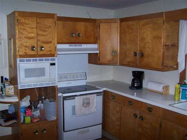 8513 South Massbach Road Elizabeth, IL 61028 - Photo 8 of 10 a kitchen with a sink and cabinets