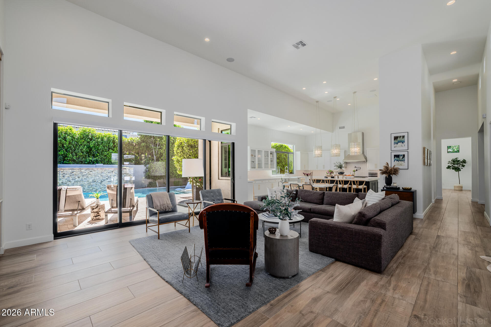 2665 East Hummingbird Way Gilbert, AZ 85297 - Photo 20 of 100 a living room with furniture large windows and wooden floor