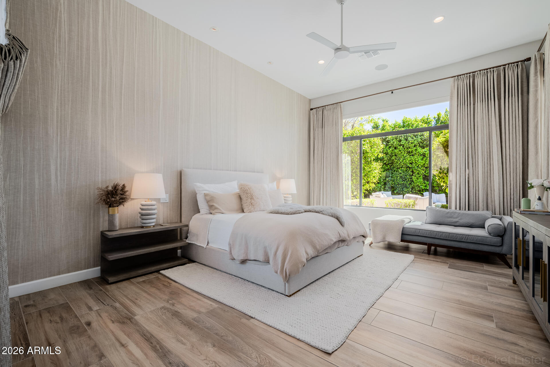 2665 East Hummingbird Way Gilbert, AZ 85297 - Photo 39 of 100 a spacious bedroom with a bed and a couch