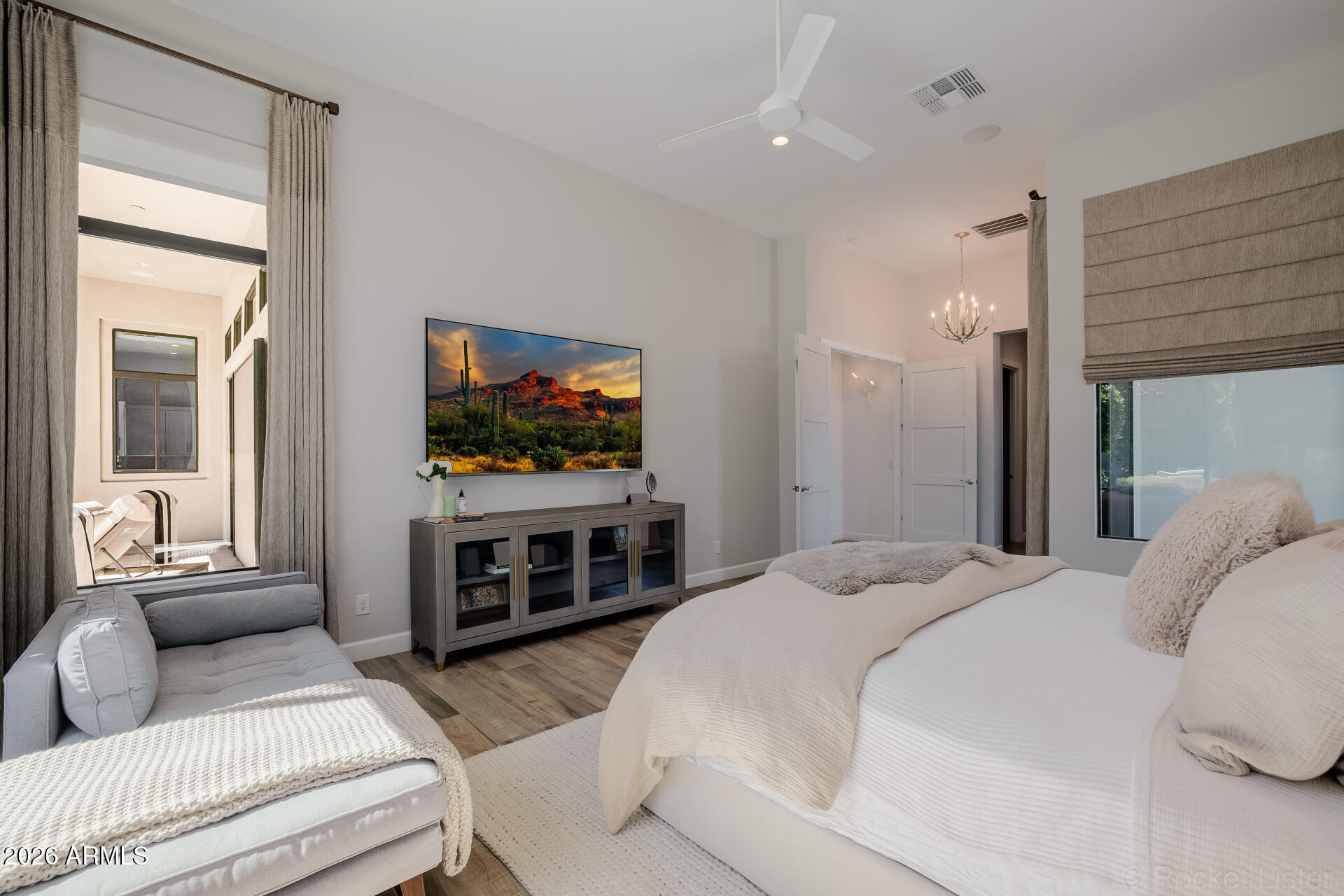 2665 East Hummingbird Way Gilbert, AZ 85297 - Photo 40 of 100 a bedroom with furniture and a flat screen tv