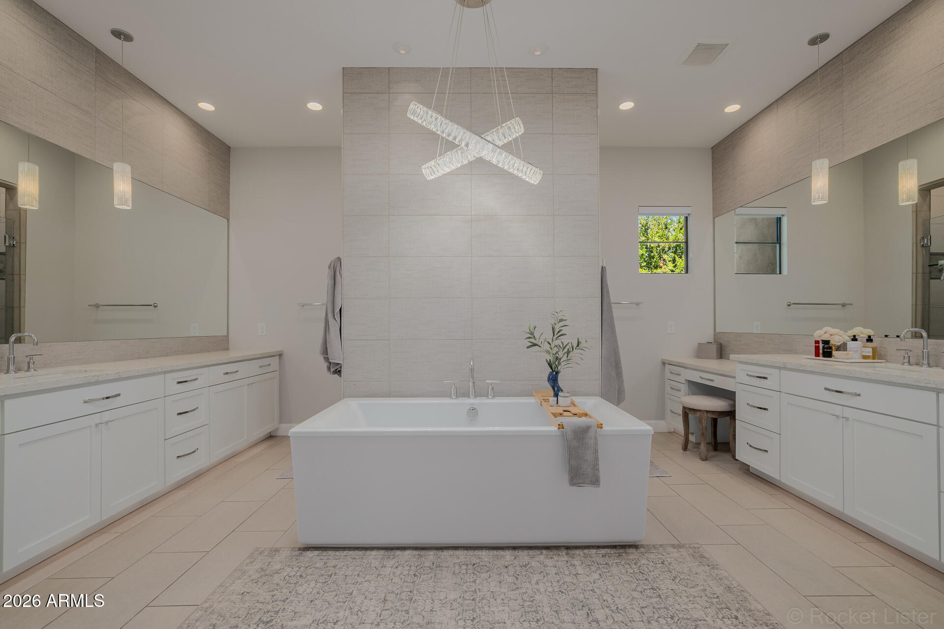 2665 East Hummingbird Way Gilbert, AZ 85297 - Photo 41 of 100 a bathroom with a tub a sink double vanity and a mirror