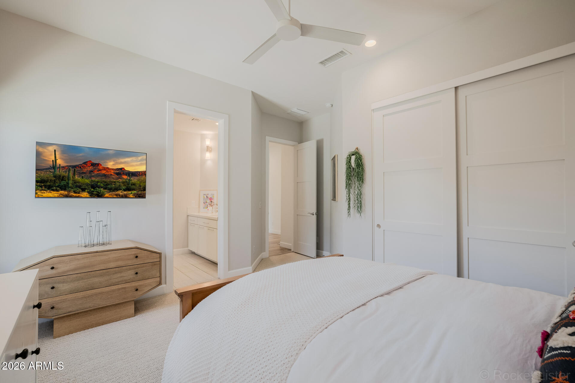 2665 East Hummingbird Way Gilbert, AZ 85297 - Photo 50 of 100 a bedroom with a bed and a flat screen tv