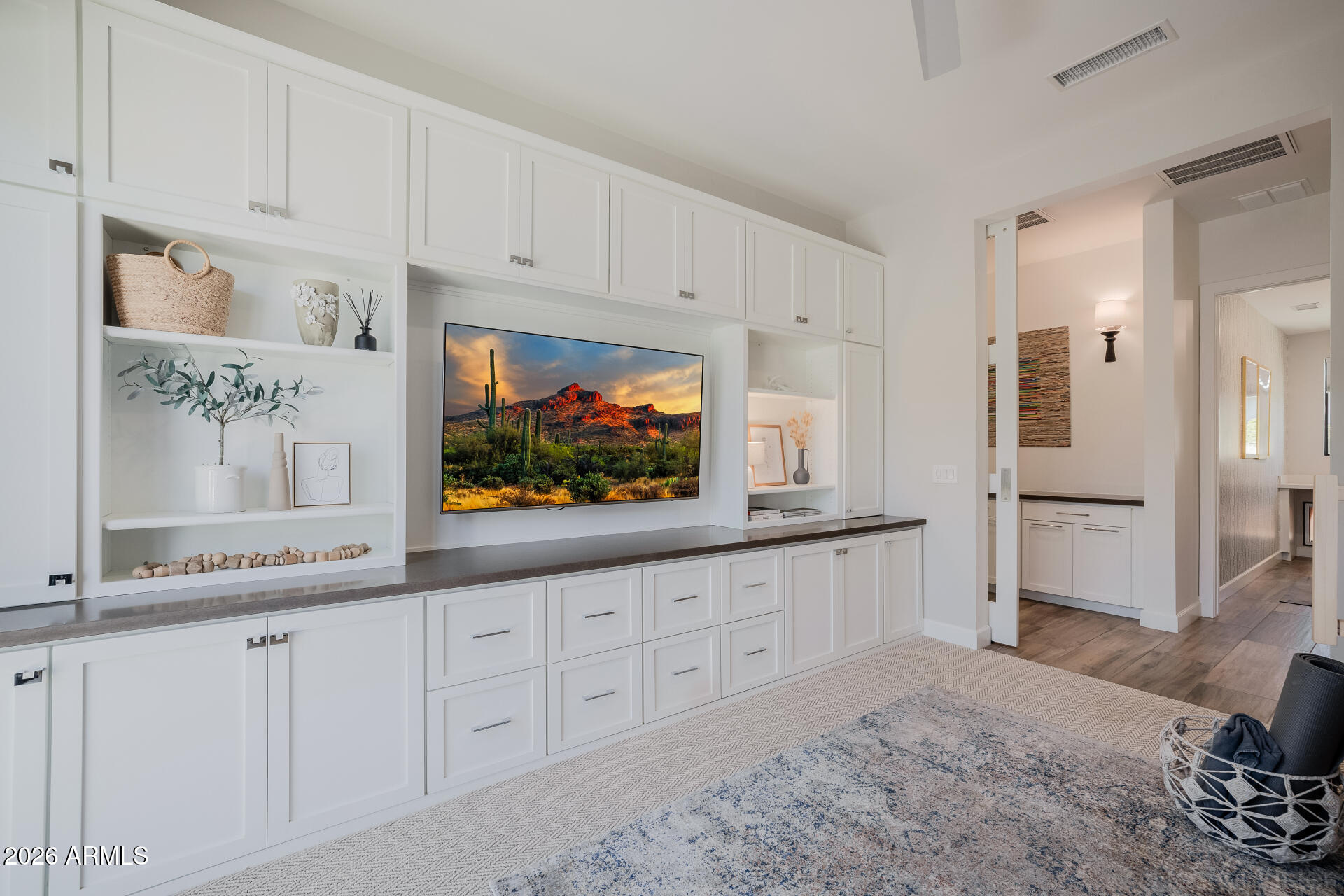 2665 East Hummingbird Way Gilbert, AZ 85297 - Photo 55 of 100 a kitchen with granite countertop white cabinets and stainless steel appliances