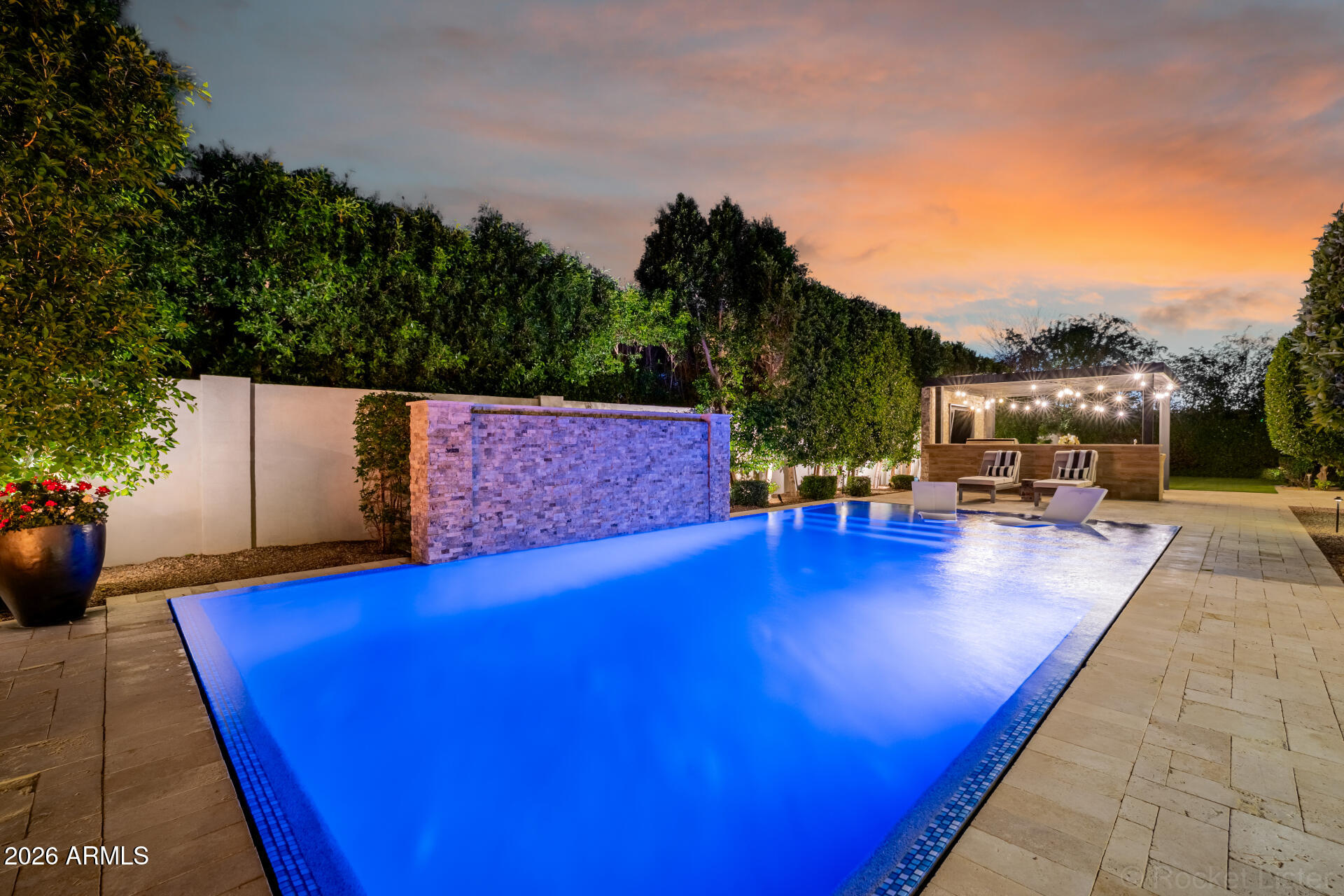 2665 East Hummingbird Way Gilbert, AZ 85297 - Photo 63 of 100 a view of swimming pool with outdoor seating and trees in the background