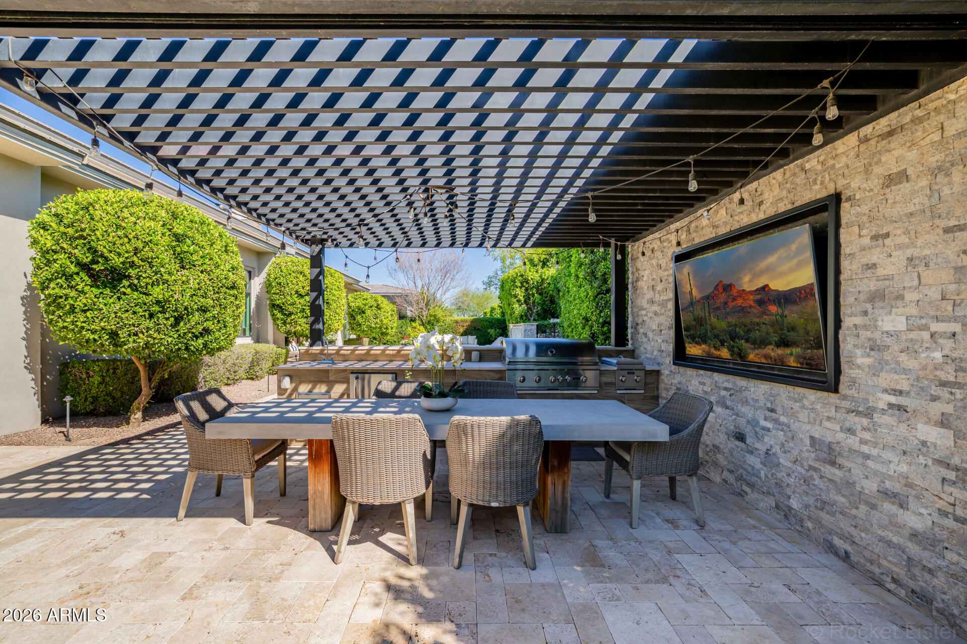 2665 East Hummingbird Way Gilbert, AZ 85297 - Photo 73 of 100 a patio with a table and chairs