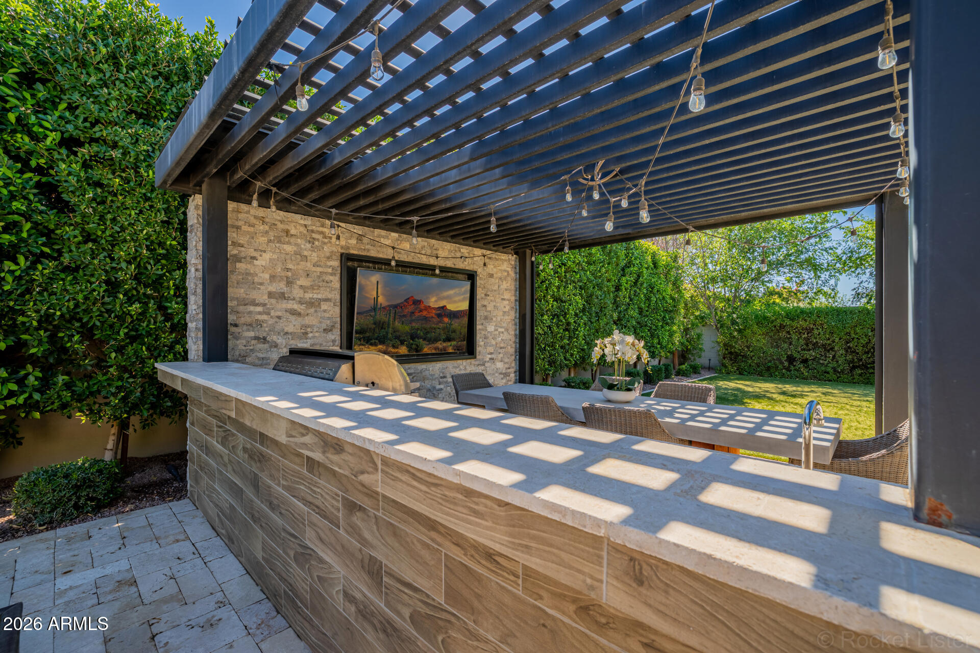 2665 East Hummingbird Way Gilbert, AZ 85297 - Photo 76 of 100 a view of a porch with furniture and a yard
