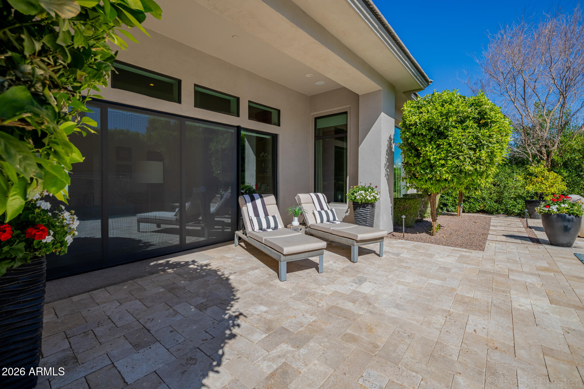 2665 East Hummingbird Way Gilbert, AZ 85297 - Photo 79 of 100 a view of a patio with a table and chairs and potted plants