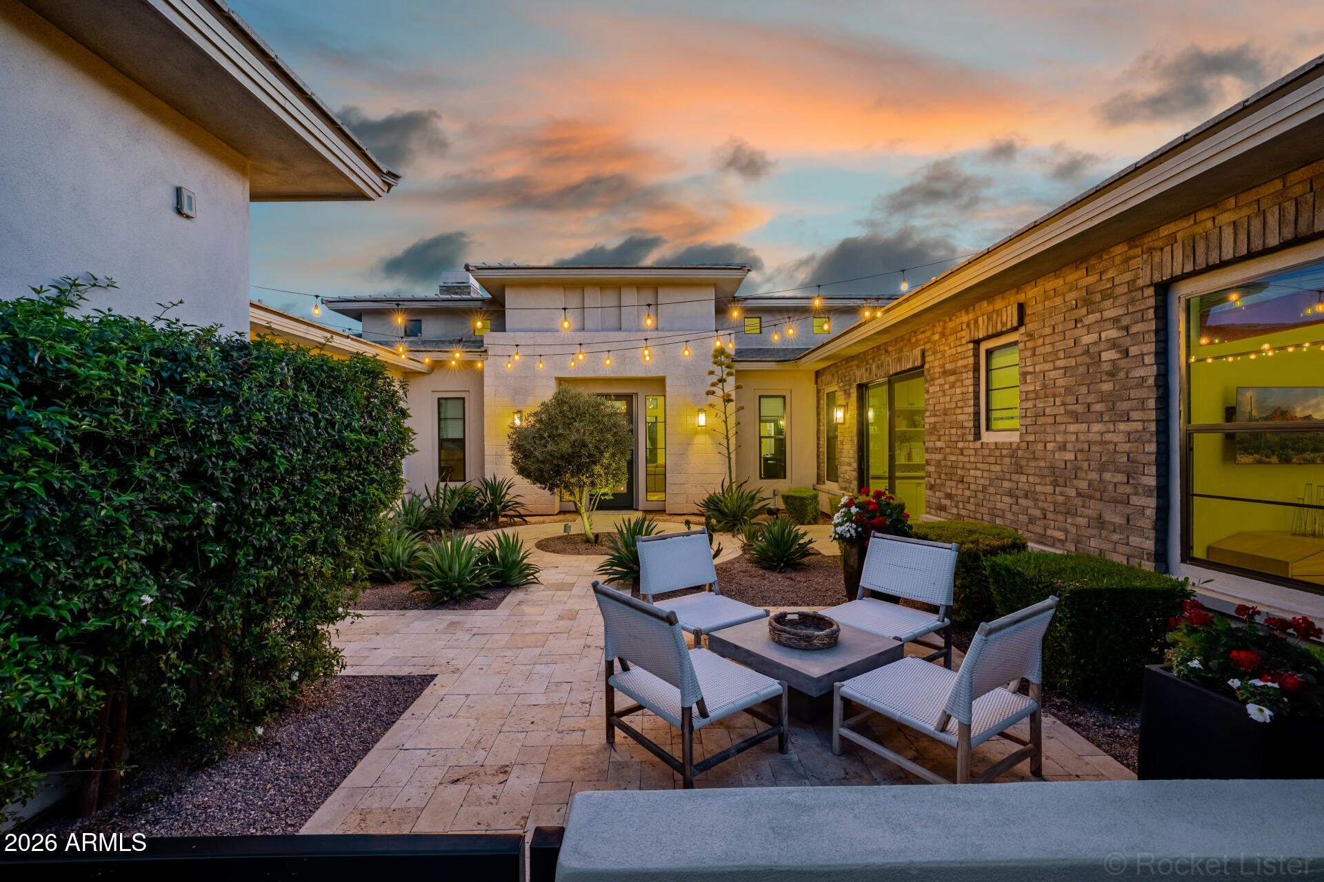 2665 East Hummingbird Way Gilbert, AZ 85297 - Photo 8 of 100 a view of a patio with couches table and chairs and potted plants