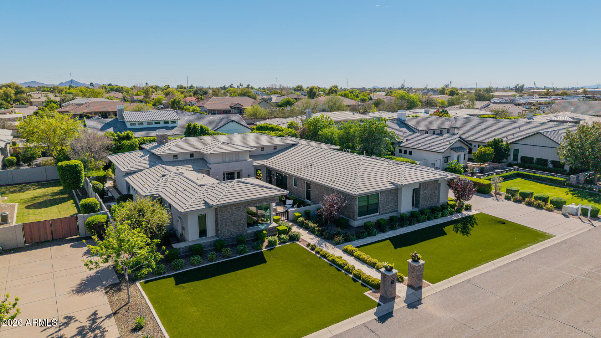 2665 East Hummingbird Way Gilbert, AZ 85297 - Photo 83 of 100 an aerial view of a house with a swimming pool yard and mountain view in back