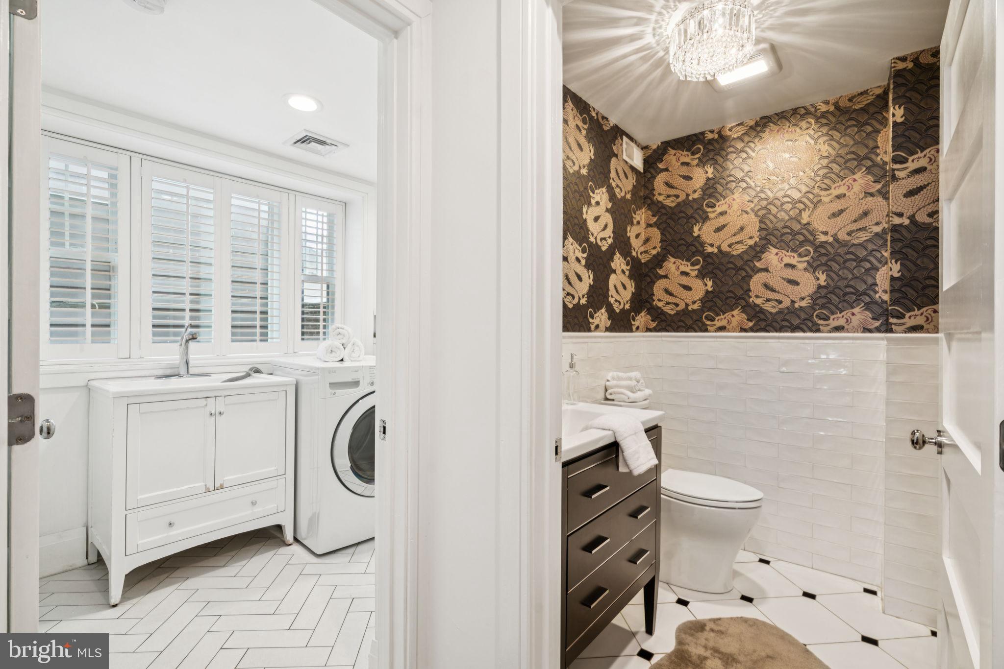 2109 Locust Street Philadelphia, PA 19103 - Photo 14 of 38 a bathroom with a toilet a sink and a mirror