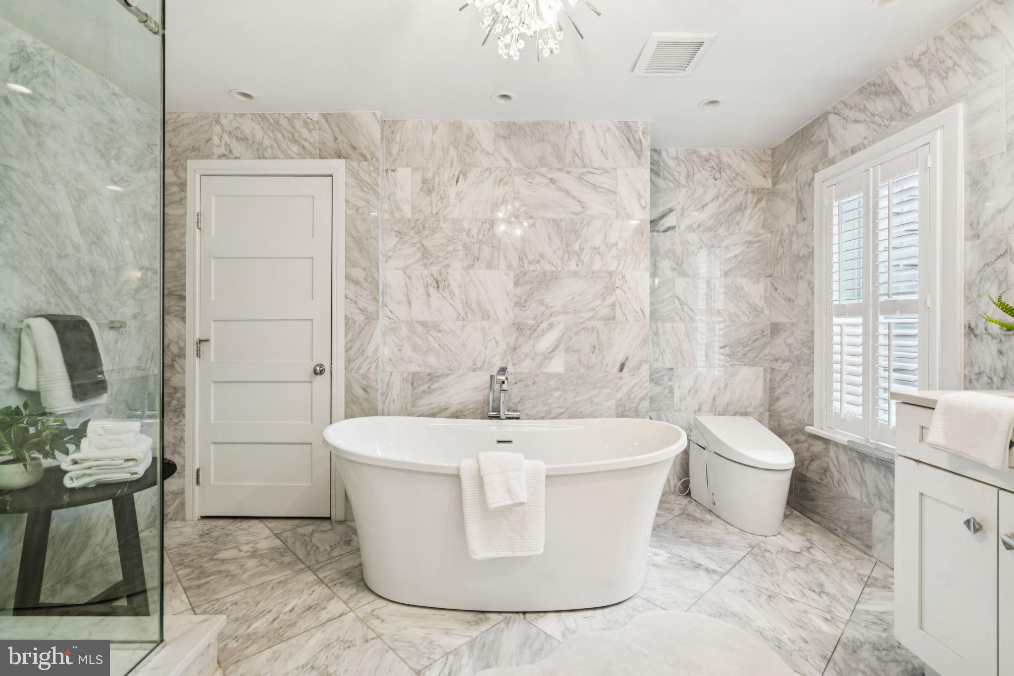 2109 Locust Street Philadelphia, PA 19103 - Photo 19 of 38 a white bath tub sitting next to a white toilet