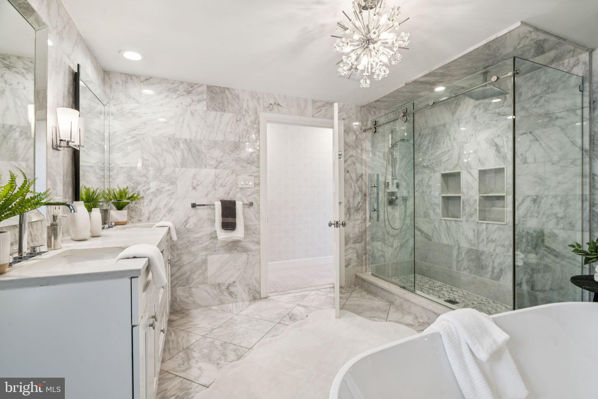 2109 Locust Street Philadelphia, PA 19103 - Photo 21 of 38 a bathroom with a bathtub shower sink and mirror