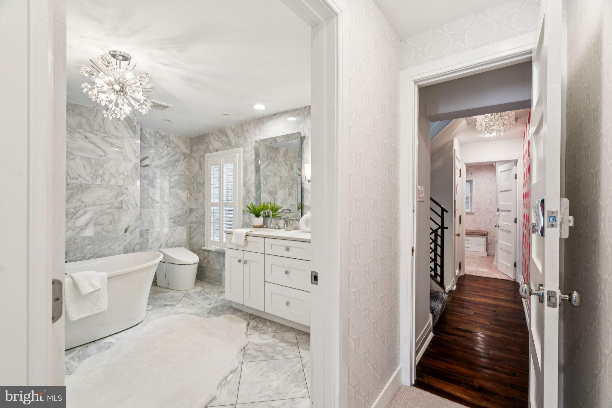 2109 Locust Street Philadelphia, PA 19103 - Photo 22 of 38 a bathroom with a sink a toilet a mirror and shower