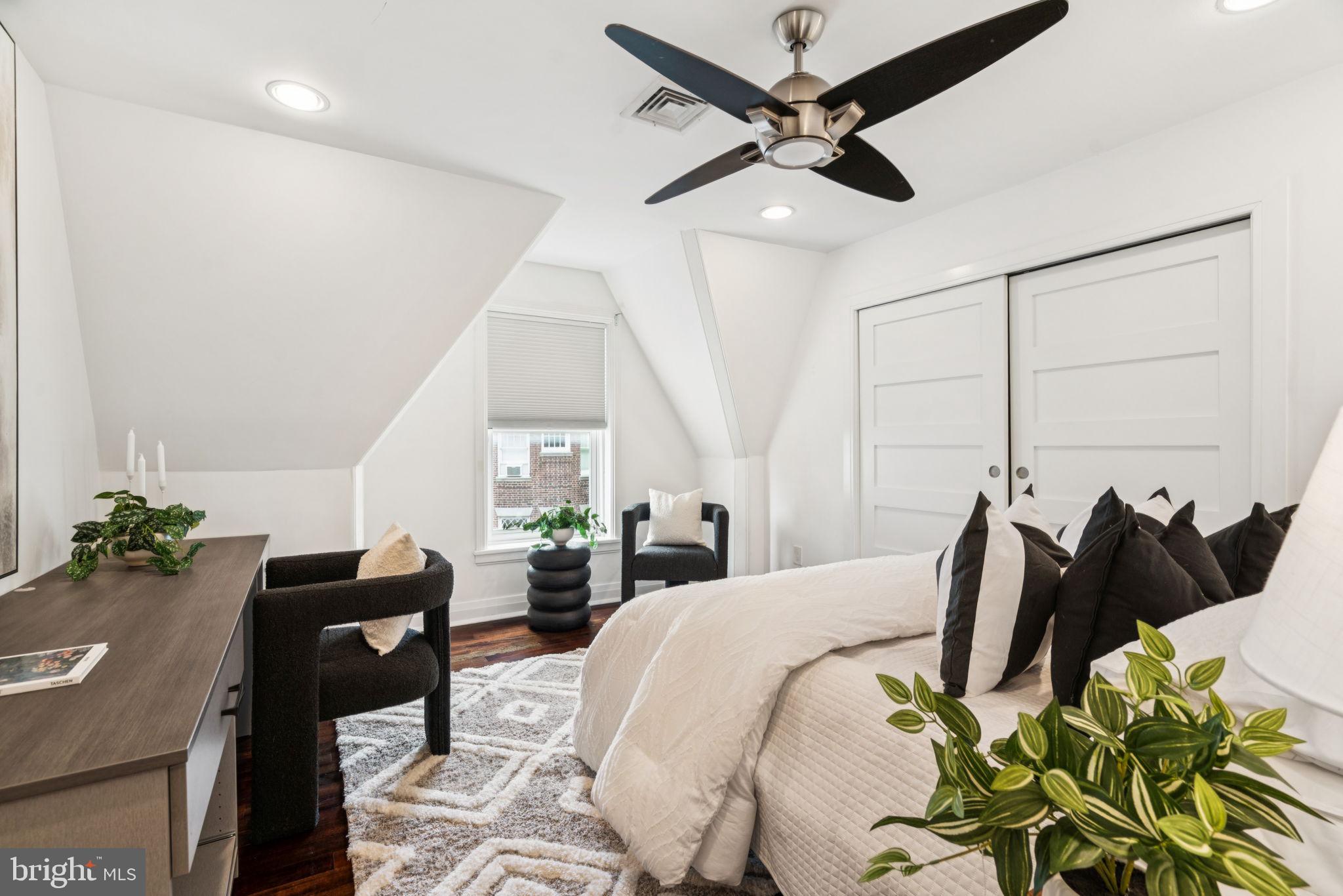 2109 Locust Street Philadelphia, PA 19103 - Photo 26 of 38 a bedroom with a bed and ceiling fan