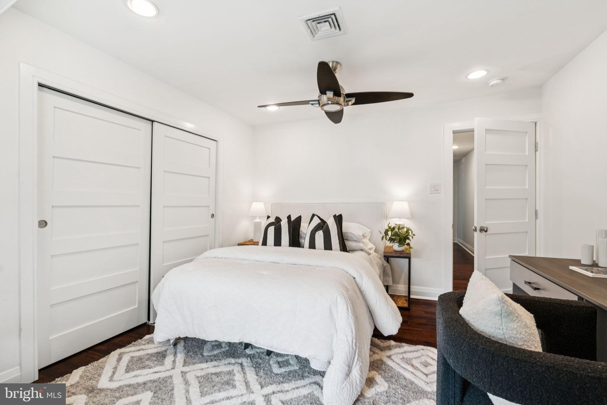 2109 Locust Street Philadelphia, PA 19103 - Photo 28 of 38 a bedroom with a bed and wooden floor