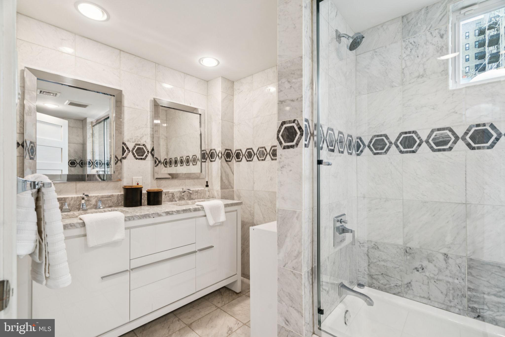 2109 Locust Street Philadelphia, PA 19103 - Photo 31 of 38 a room with a sink a mirror and a shower