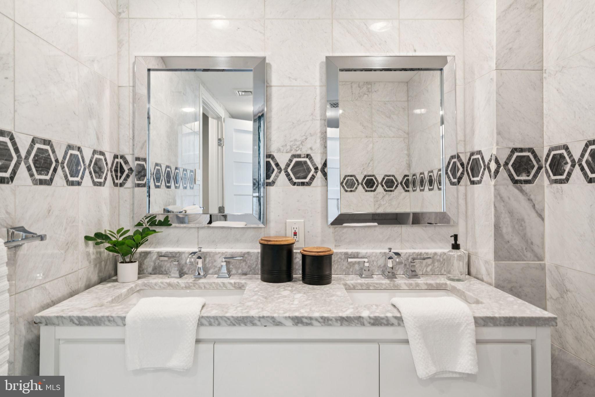 2109 Locust Street Philadelphia, PA 19103 - Photo 32 of 38 a bathroom with a granite countertop sink a mirror and shower