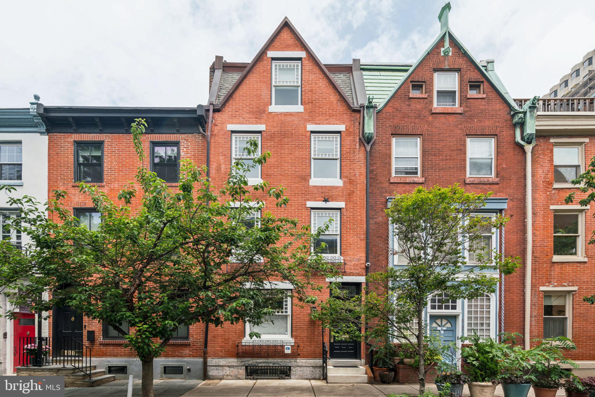2109 Locust Street Philadelphia, PA 19103 - Photo 37 of 38 a front view of a residential apartment building with a yard