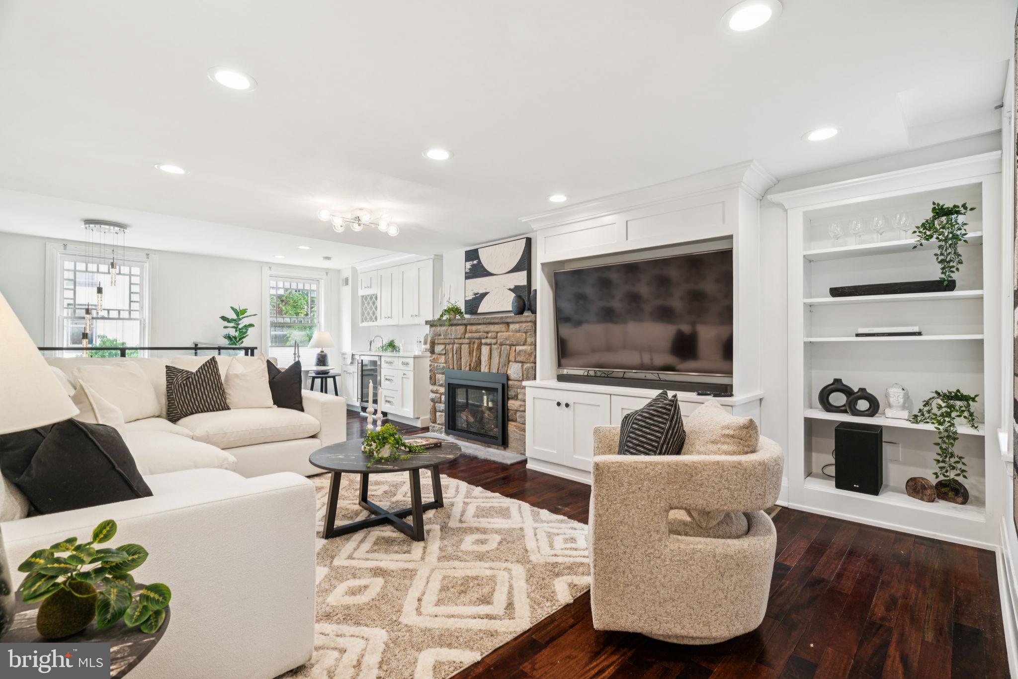 2109 Locust Street Philadelphia, PA 19103 - Photo 10 of 38 a living room with furniture and a flat screen tv