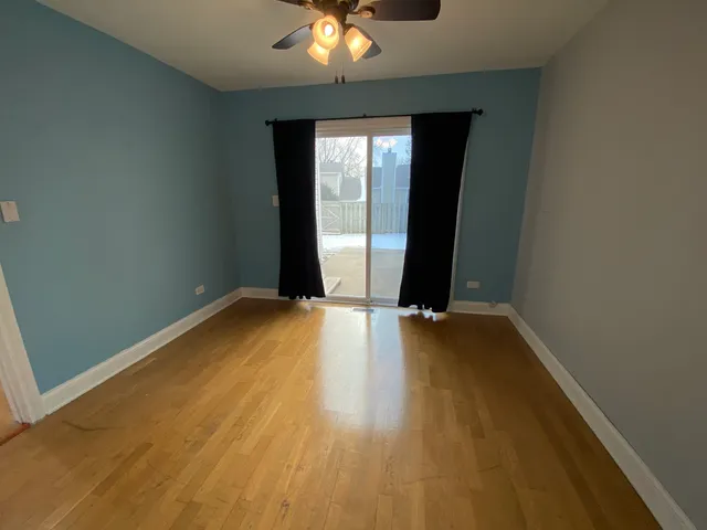 wooden floor and window in an empty room