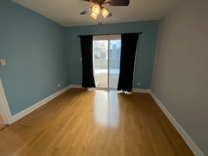 wooden floor and window in an empty room