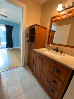 a bathroom with a double vanity sink and mirror