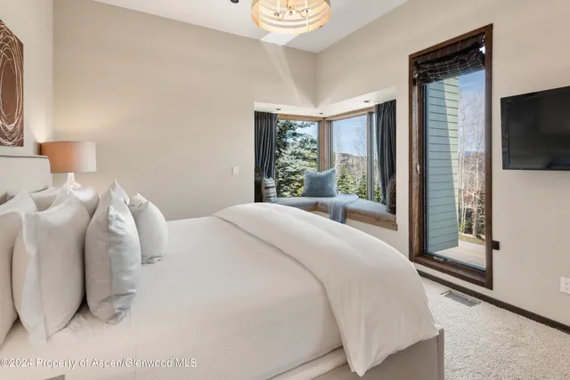 a bedroom with double bed and a closet