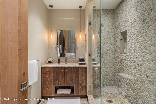 a spacious bedroom with a bed and a large window