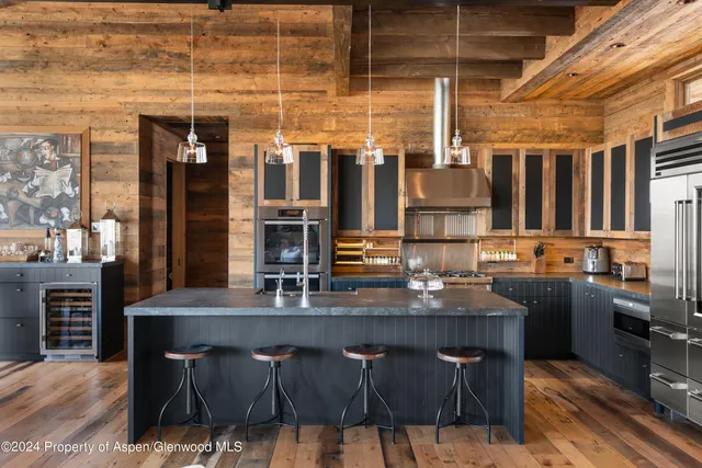 a kitchen with a counter space cabinets and appliances