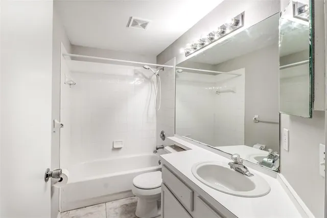 a view of a house with a big yard and plants