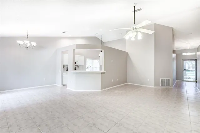 a view of a kitchen with cabinet and a chandelier