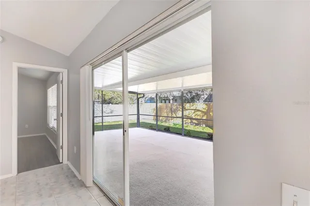 a view of an empty room with a large window