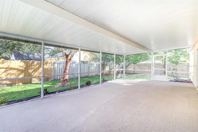 a view of a wooden deck with a yard