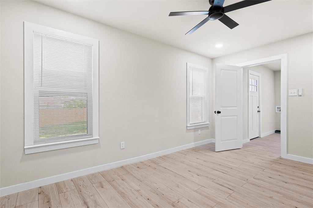 1300 East Baltimore Avenue Fort Worth, TX 76104 - Photo 11 of 25 a view of empty room with wooden floor and fan