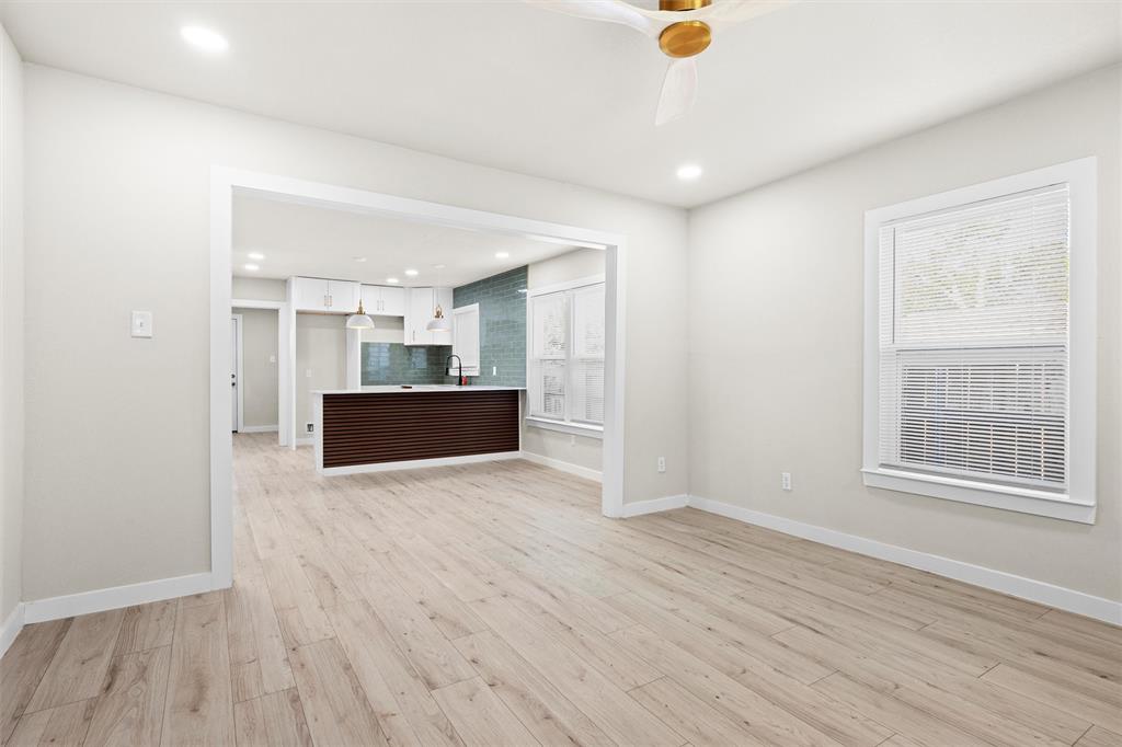 1300 East Baltimore Avenue Fort Worth, TX 76104 - Photo 4 of 25 a view of kitchen and hall with wooden floor